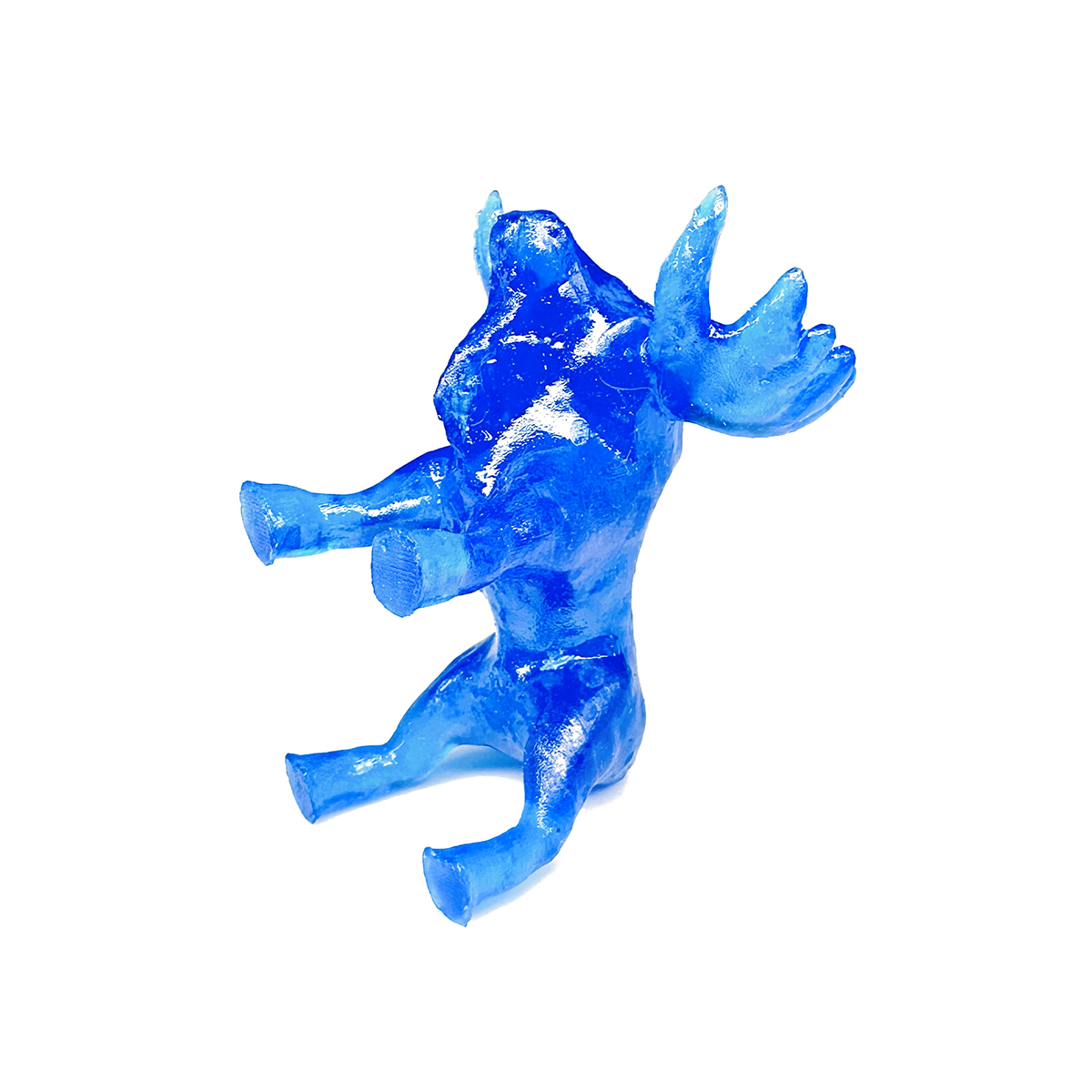 Photo of moose-shaped dice with its tail with back legs touching the ground.